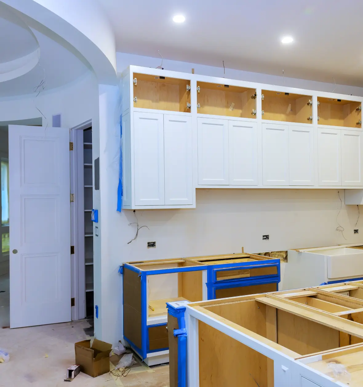 Group 8 (8) (1) Kitchen under renovation with new cabinets installed.