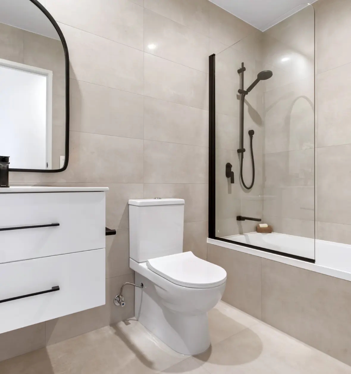 Group 8 (8) (5) Modern bathroom with toilet and shower.