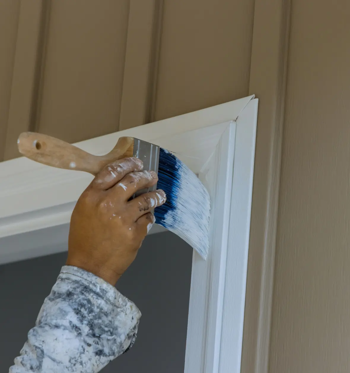 Group 8 (8) (9) Hand painting door frame with brush.