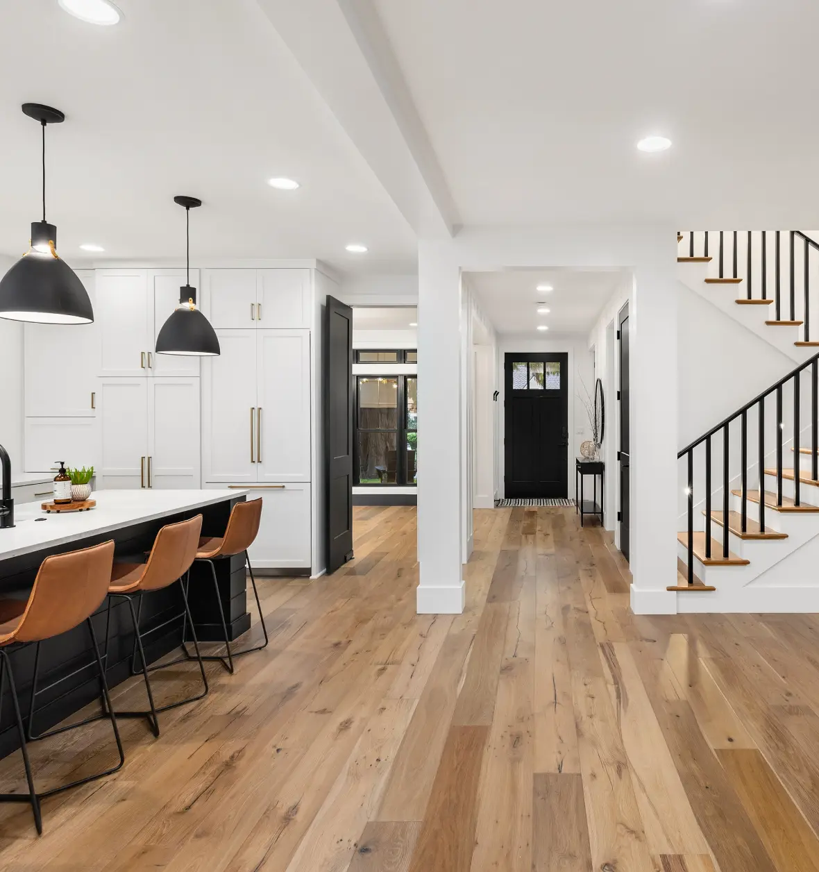 Group 8 (8) Modern kitchen and hallway with wooden flooring.